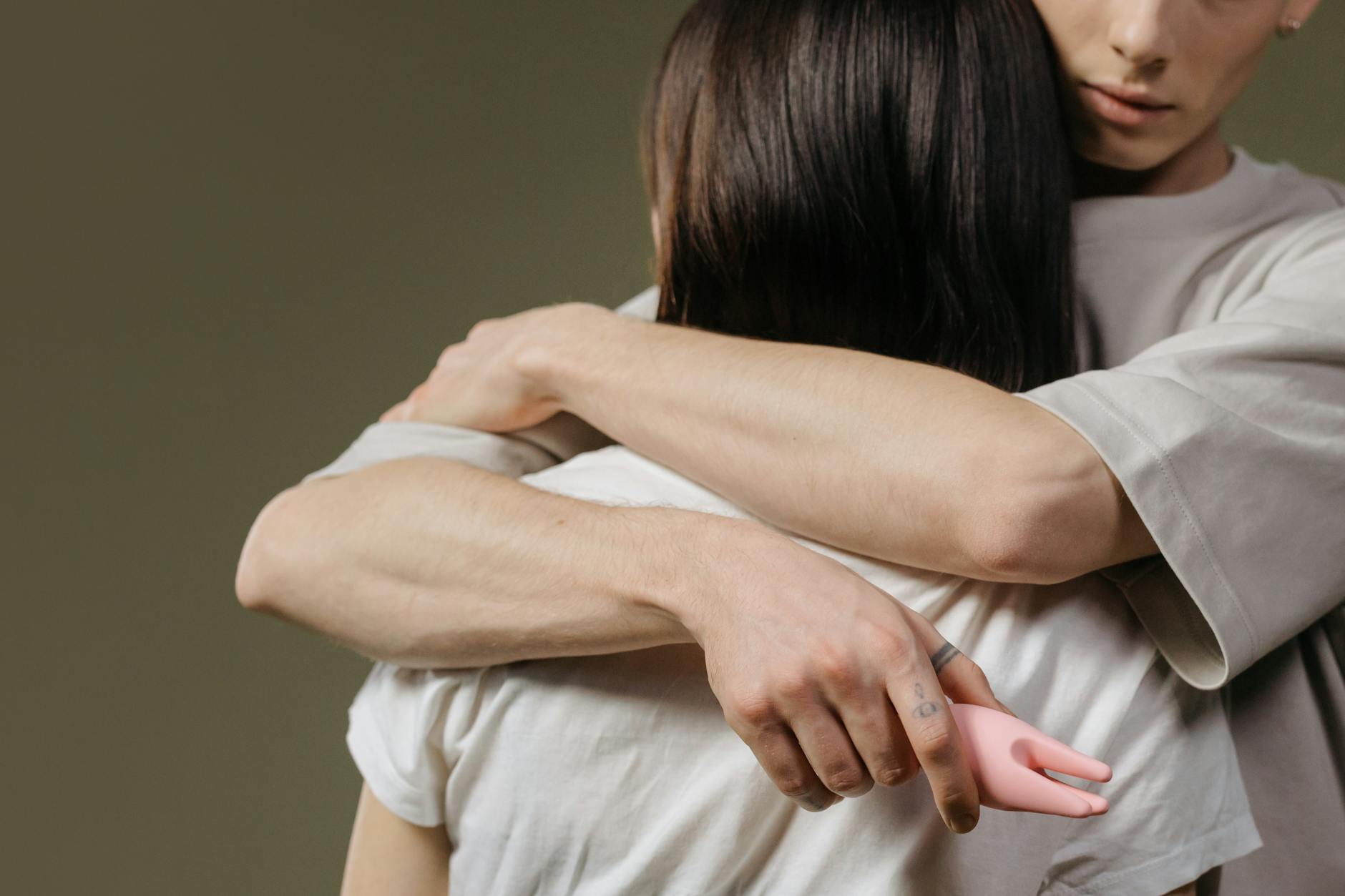 Close-up of a couple embracing, highlighting how different vibrators impact intimacy and connection
