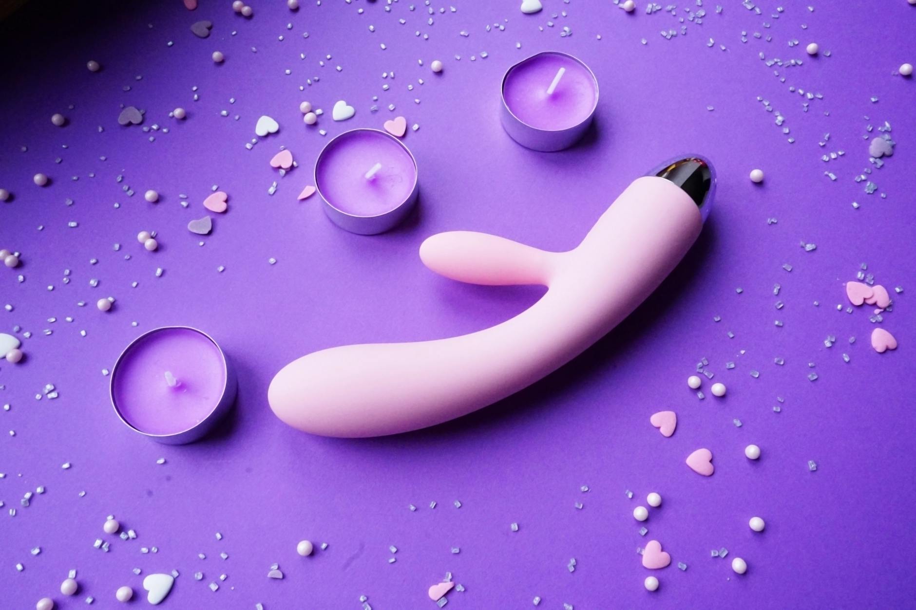 Woman holding a vibrator and considering how to rebuild sensation